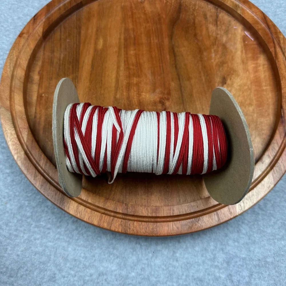 Red and White Braided Flat Cord Trim Spool for Sewing and Crafts